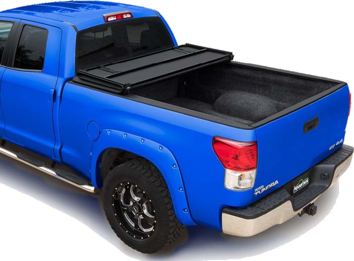 Folding tonneau cover on a gray chevy pickup